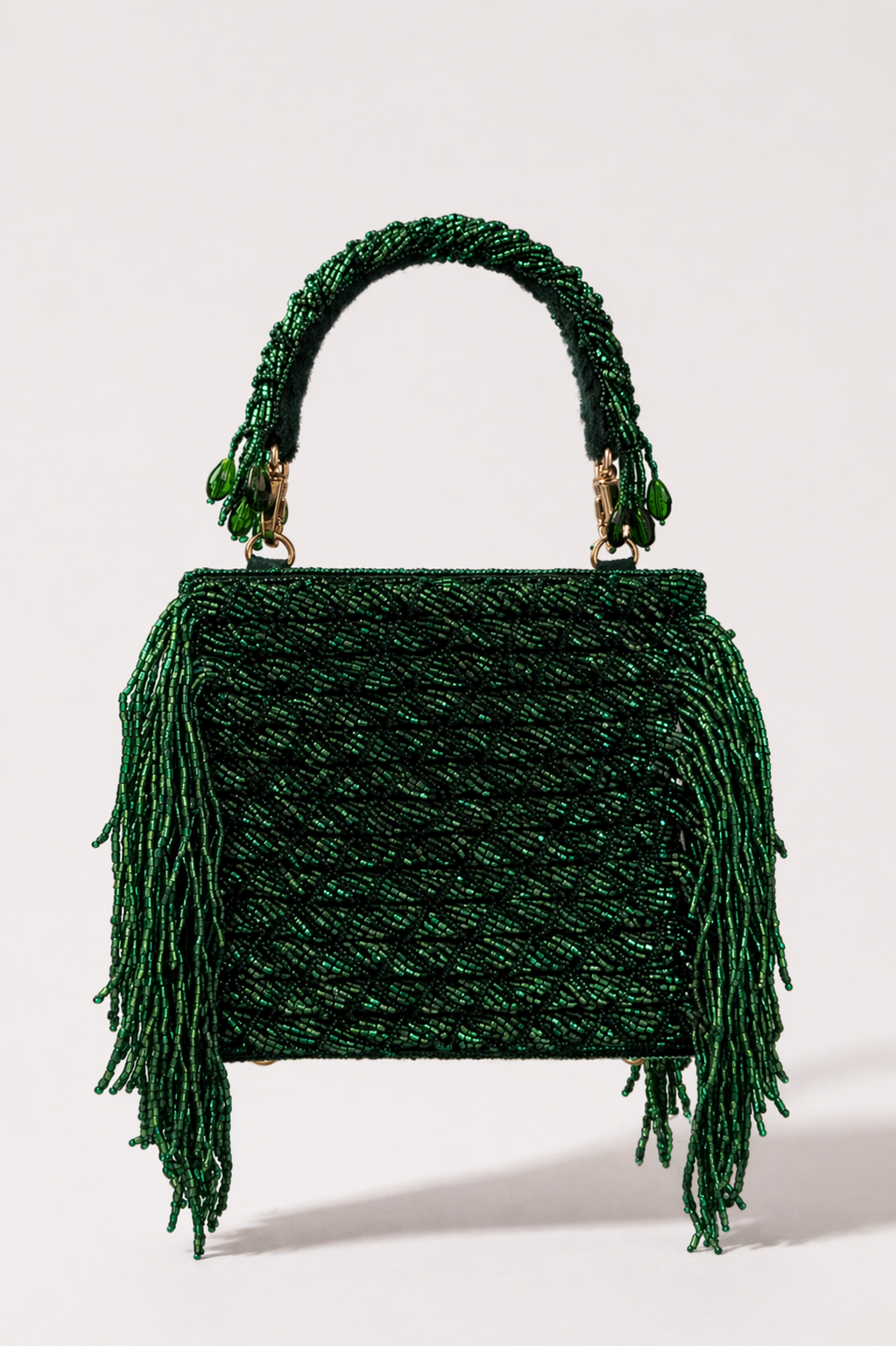 Sona Jaal green wedding guest clutch with beadwork and fringe detailing