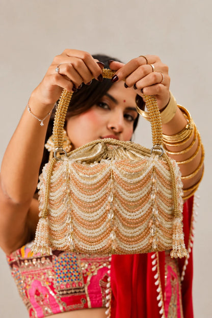 Statement golden clutch bag for festive and wedding occasions