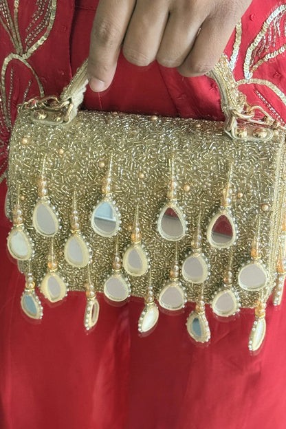 Golden flap bag for wedding functions and celebrations