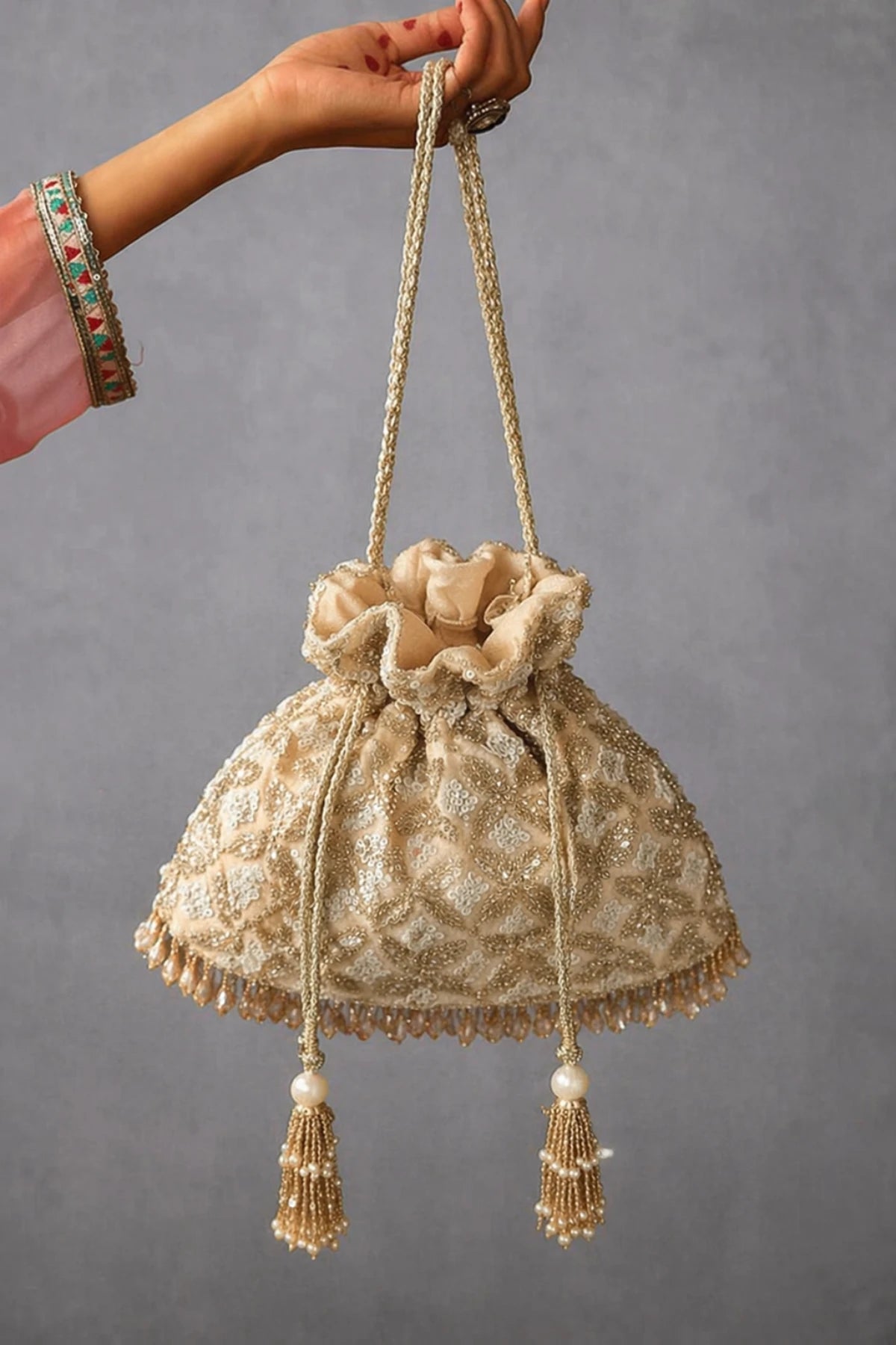 Golden wedding potli bag for brides and wedding receptions