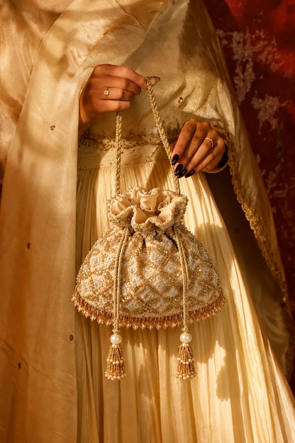 Golden wedding potli bag for brides and wedding receptions