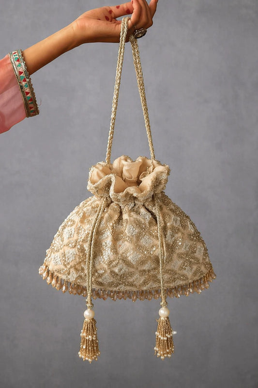 Golden wedding potli bag for brides and wedding receptions