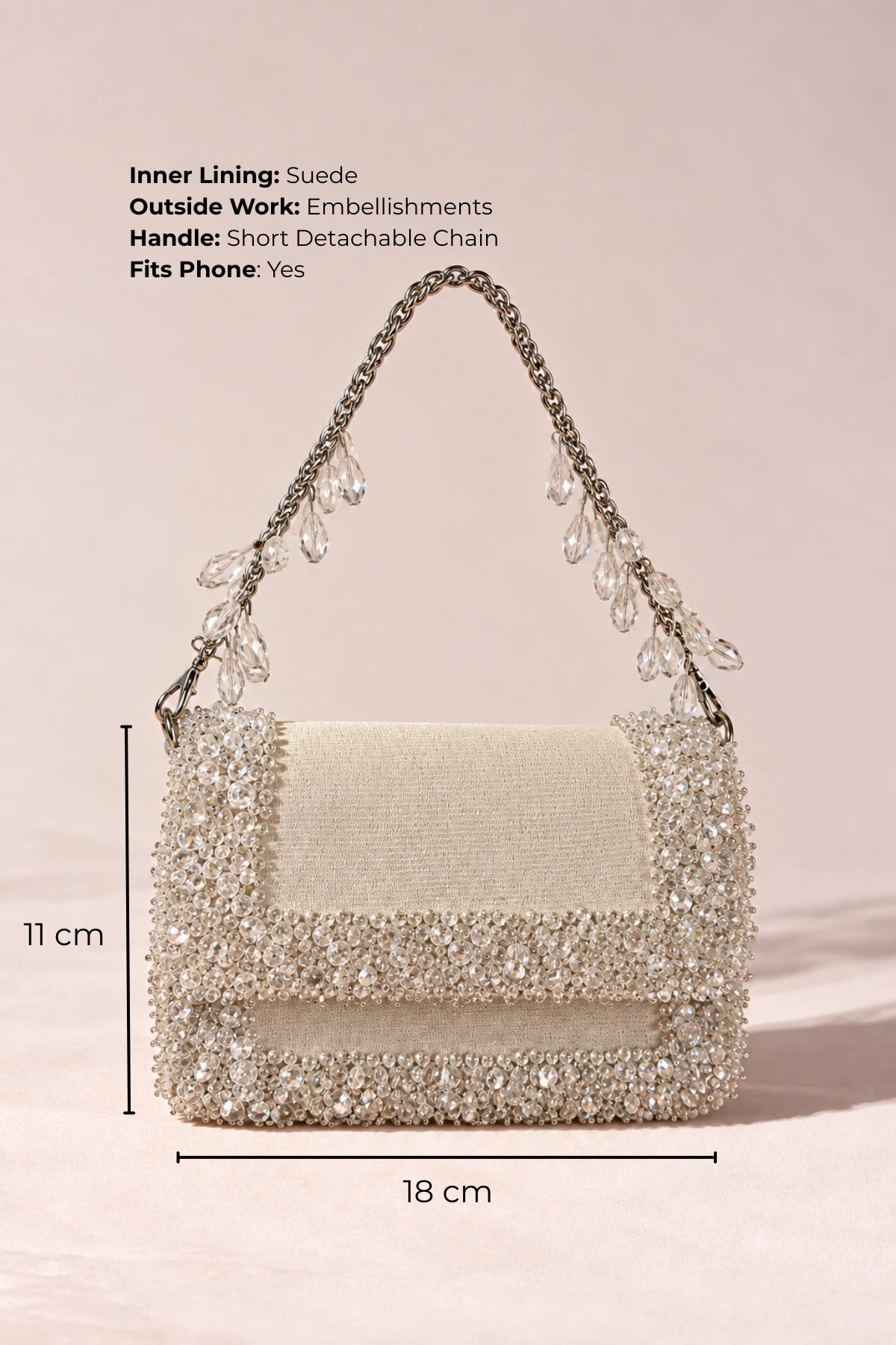 White designer handbag with delicate crystal embellishments, styled with dresses, co-ord sets and linen ensembles.