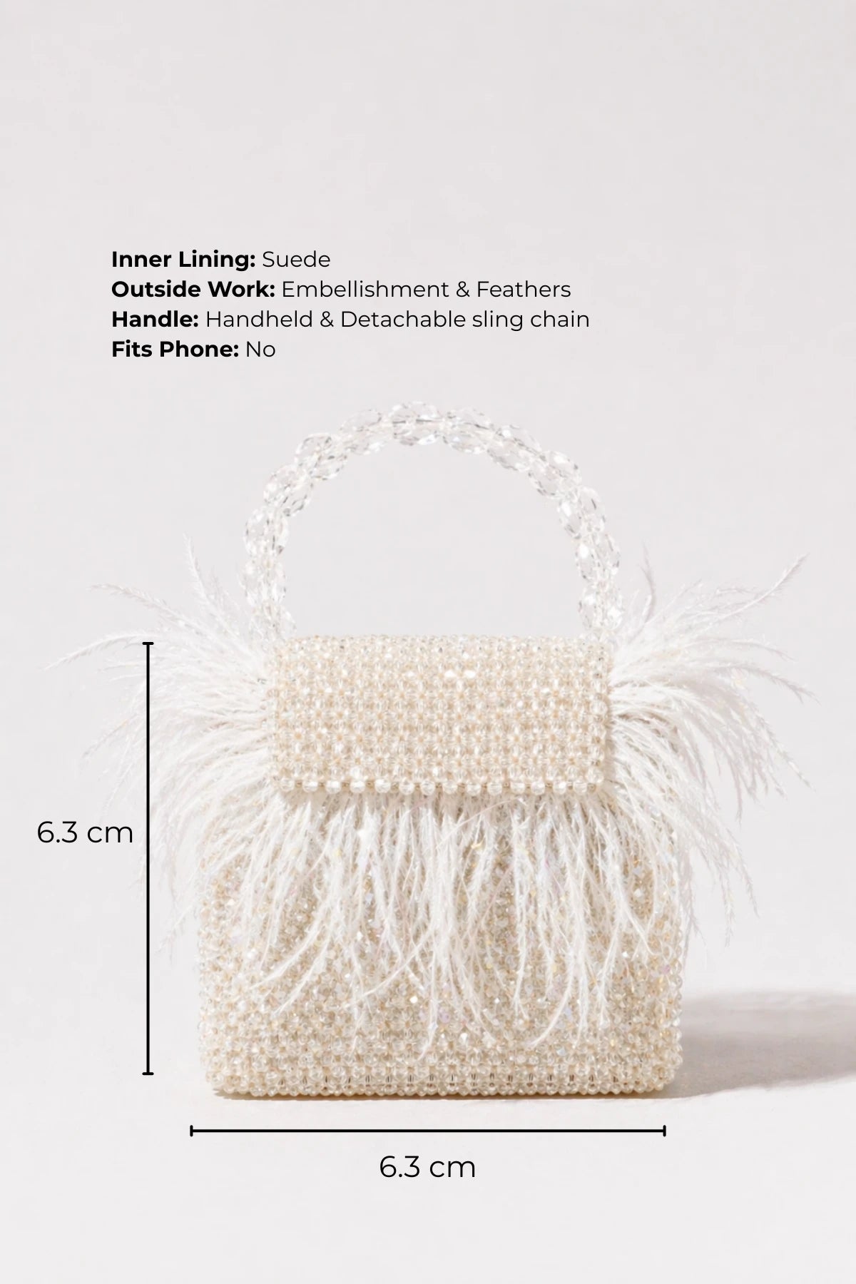 White mini bag styled with resort wear for tropical vacations