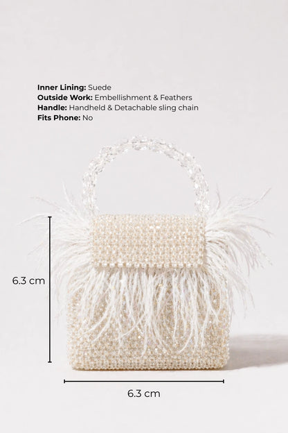 White mini bag styled with resort wear for tropical vacations