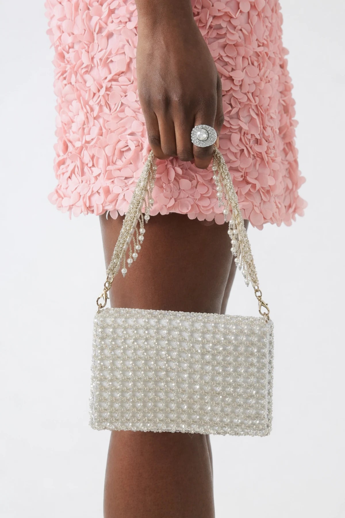 White shoulder bag styled with a western party dress